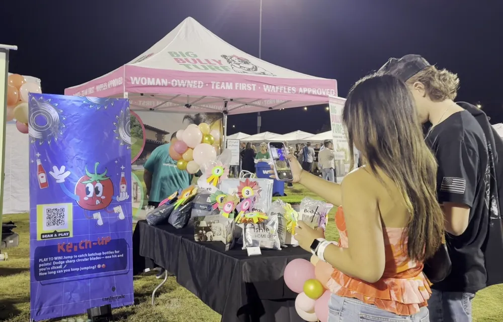 Crowded trade show booth game attracting attendees and generating engagement for a CPG brand.